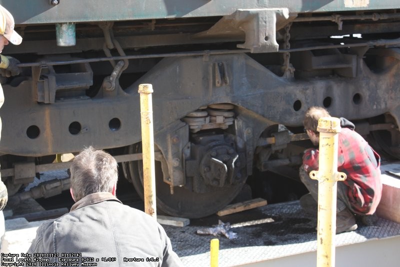 Jamie checks the motor nose supports to align them with the truck supports to slide the nose pack back into place.