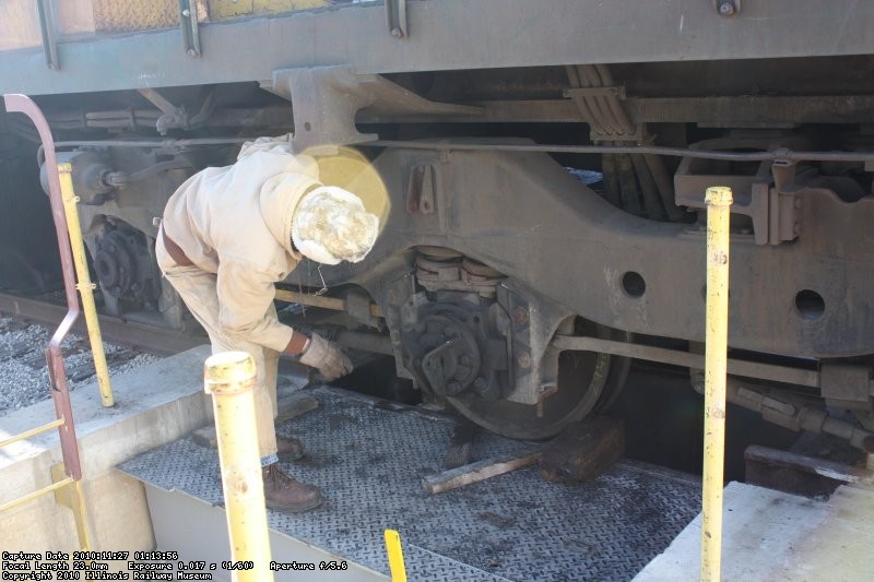 Roger B. Checks the the top of the box on the firemans side to make sure the springs seat properly as the combo is raised.