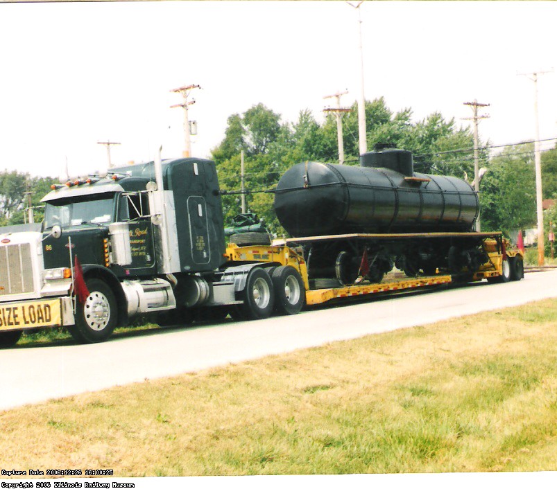 THE RESTORED CAR ARRIVES ON OLSEN ROAD ON SILK ROADS TRANSPORTS SPECIAL TRAILER.