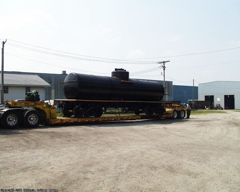 THE CAR IS NOW SECURED ONTO THE TRAILER FOR TRANSPORT.