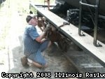 07.27.08 - KIRK WARNER DRILLS A HOLE IN THE LEFT RUNNING BOARD TO ATTACH IT TO THE MOUNTING BRACKETS.