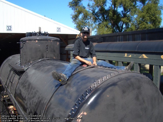 08.0910 -JOHN BALETTO SANDING THE RIVETS.  VICTOR HUMPRHEYS, KIRK WARNER AND JOHN BALETTO SANDED ON THE CAR ON SATURDAY AND SUNDAY.  IT IS ALMOST READY FOR THE FINAL COAT OF PAINT.