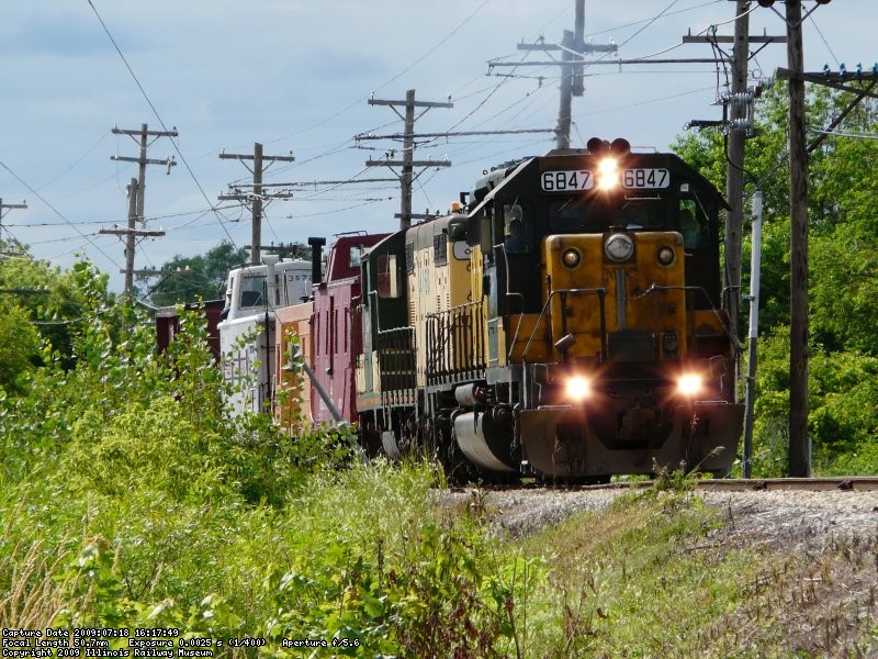 CNW 6847 and 4160 lead the caboose train on 7/18/09