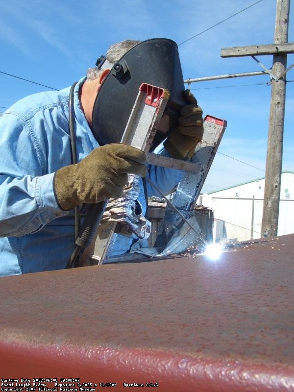 06.06.07 - NEIL SCHWINGBECK IS WELDING THE LEAK ON THE ROOF OF THE CAR.