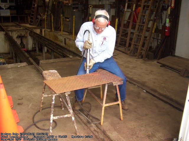 08.19.07 - KIRK WARNER IS NEEDLE CHIPPING THE DIAMOND PLATE FOR THE FLOOR THRESHOLD FOR THE B END OF THE CABOOSE.