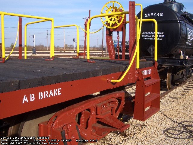 11.04.047 - THE BL STEPS HAVE BEEN STRAIGHTENED, REAPPLIED TO THE CAR AND PAINTED.  ALL OF THE HANDRAILS AND HANDBRAKE HANDWHEEL HAVE BEEN NEEDLE CHIPPPED AND PAINTED YELLOW.