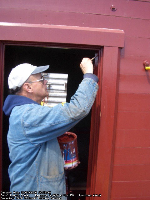 05.21.08 - VICTOR HUMPHREYS PAINTS PREVIOUSLY PRIMED AREAS OF THE DOORFRAME.