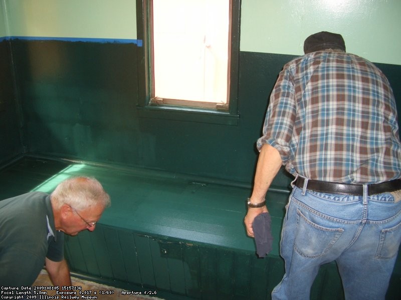 08.05.09 - HERE LEE AND BOB ARE APPLYING MORE FINSIH PAINT TO THE LOWER SECTION OF THE INTERIOR.