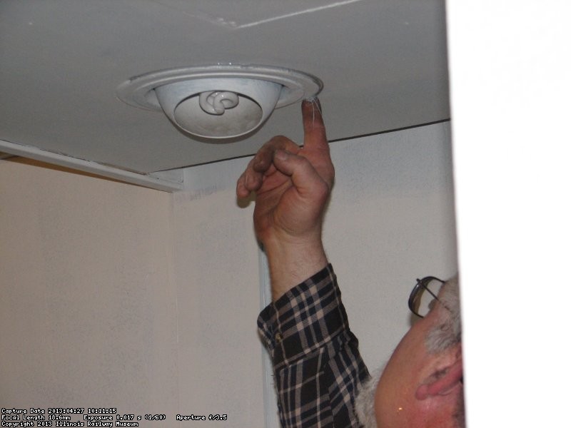 Here Mike seals the edged of the light fixture.