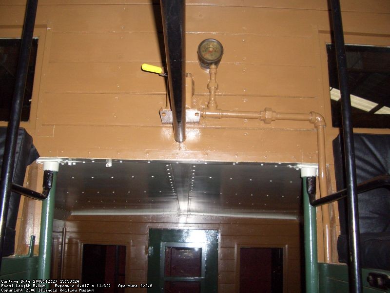 12.27.06 - THIS SHOWS THE BRAKE SYSTEM AIR PRESSURE GAGE AND THE CONDUCTOR'S BRAKE CONTROL VALVE.  THE EXTERIOR VENT OF THIS CONTROL VALVE HAS BEEN PLUGGED SO THAT GUEST RIDERS CANNOT OPERATE THE BRAKE SYSTEM WHILE RIDING IN THE CABOOSE.