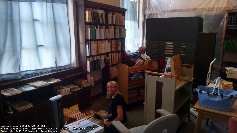 Volunteers Jan Galayda and Julie Piesciuk sort through the "for sale" extra books at the Strahorn Library 08/23/2015.