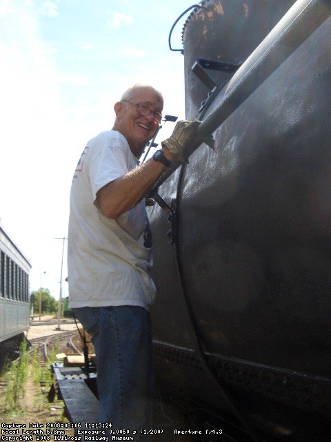08.06.08 - DICK CUBBAGE IS SANDING THE RIVETS IN PREPARATION FOR HAVING THE TANK RESPRAYED.