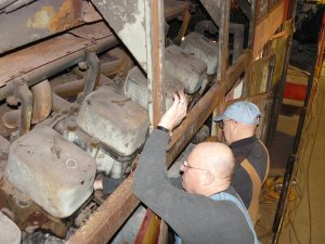 Marcus and Frank changing some gaskets to fix some water leaks around the engine.