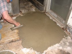 Mike Baksic troweling the area in front of the Birmingham galley door.