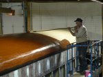 Jeff painting/sealing the wood roof.