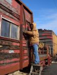 01.07.07 - JOEL AHRENDT IS NEEDLE CHIPPING THE EXTERIOR FRAME.  THE FIRST STEP IN PREPARING FOR PAINT, PRIOR TO NEW SIDING APPLICATION.  JOEL IS SPENDING HIS EIGHT HOUR WORK PERIOD IN THE FREIGHT CAR DEPARTMENT AS HE WORKS TOWARD REGULAR MEMBERSHIP AT THE IRM.  IT IS JANUARY 7, 2007 AND THE WEATHER IS COOPERATING! 