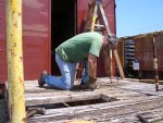 06.20.07 - ED "DOC" WALSH STARTS TO REMOVE THE OLD. ROTTEN WOOD DECKING ON THE A END SO THAT NEW WOOD, DECKING CAN BE APPLIED.