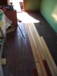 07.12.07 - AN INTERIOR VIEW OF THE NEW WOOD FLOORING BEING APPLIED.  NOTE THE TARPAPER THAT HAS BEEN APPLIED OVER THE SUBFLOOR, PRIOR TO THE FINISH FLOORING APPLICATION.