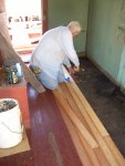 07.15.07 - KIRK WARNER IS INSTALLING THE NEW SECTIONS OF FLOORING TO REPLACE THE DECAYED WOOD.