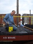 08.18.07 - MARK ST. GERMAIN IS TOUCHING UP NEWLY APPLIED DECK BOARDS.