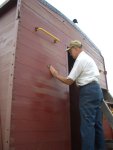 08.18.07 - VICTOR HUMPHREYS SANDS THE PRIMER, WHICH WAS APPLIED WHERE FINISH PAINT HAD PEELED, PRIOR TO APPLYING THE SECOND COAT OF FINSIH PAINT TO THE A END OF THE CABOOSE WALL.