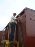 08.18.07 - VIICTOR HUMPHREYS HAS PAINTED THE A END OF THE CABOOSE AND IS NOW APPLYING FINISH PAINT TO THE RIGHT SIDE OF THE CABOOSE.
