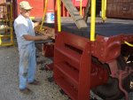 09.09.07 - VICTOR HUMPHREYS APPLIES THE FINAL COAT OF PAINT TO THE COMPLETED AR STEPS.  INTERESTINGLY, WE HAVE PHOTO SHOWING THAT THE AR, BR AND BL STEPS WERE PAINTED MINERAL RED, WHILE THE AL STEPS WERE PAINTED YELLOW.  THE CAR WILL BE RETORED IN THAT MANNER.