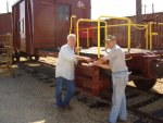 09.09.07 - KIRK WARNER AND VICTOR HUMPHREYS ARE BOLTING THE STRAIGHTENED AND PAINTED PARTS OF THE AR SILL STEPS TOGETHER.  IN THE BACKGROUND, THE HINGES TO THE A END DOOR WERE INSTALLED TODAY.