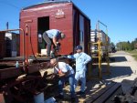 09.12.07 - DICK CUBBAGE IS REPACKING THE R2 JOURNAL BOX.  THE ENTIRE B TRUCK WAS REPACKED TODAY.  THE BL SILL STEPS WERE ALSO REMOVED.  JOHN FAULHABER DRILLS A HOLE TO SECURE THE DECKING, WHILE SON JAMES FAULHABER WAITS TO THE RIGHT TO APPLY A TIMBER BOLT.  KIRK, JOHN AND JAMES APPLIED SEVEN MORE DECK BOARDS TODAY.