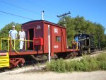 09.12.07 - HENRY VINCENT HAS CHANGED THE POLE PRIOR TO CHANGING DIRECTION ON THE MAINLINE.  JOHN AND JAMES FAULHABER ARE ON THE DECK OF THE CABOOSE, ENJOYING THE RIDE.