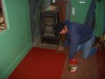 11.28.07 - VICTOR HUMPHREYS APPLIES THE FIRST COAT OF FINSIH PAINT TO THE LEFT SIDE FLOOR.