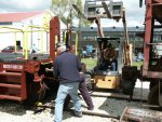 05.18.08 - KIRK WARNER USES A SLEDGE HAMMER TO DRIVE OUT THE COUPLER CROSSKEY WHILE RAY POLLICE HOLDS THE BAR.  A COUPLER WEAR PLATE HAS TO BE INSTALLED.  NICK KALLAS IS OPERATING THE SKID LOADER TO LIFT THE COUPLER.