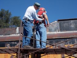 Chuck Pomazal helped Chuck Trabert into the respirator - Photo by Jane Pomazal