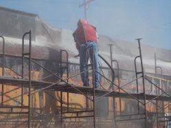 Chuct Trabert began sandblasting before noon - Photo by Jane Pomazal