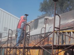 Another shot of Chuck T sandblasting - Photo by Jane Pomazal