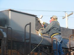 Chuck P applying primer - Photo by Chuck Trabert