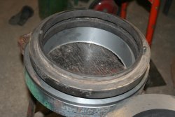 Old bull ring sits on top of the cast iron blank from which a replacement will be machined