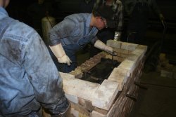 The shoe is in the furnace and Jason adjusts the mold within it