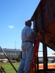 06.30.10 - MIKE ALTERIO INSTALLS A RIVET ON A LADDER ON THE CAR.