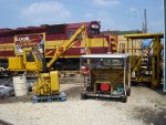 Multiple MOW equipment in view with three locomotives tied down in yard 2