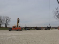 The forklift gets into position to keep the bottom from dragging as the top is lifted.