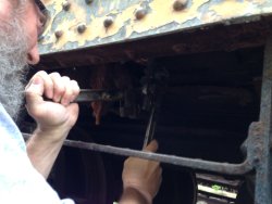 Chuck Trabert used two wrenches to open the boiler drain