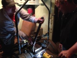 X-5000 volunteer Brian LaKemper (left) and Jeron Glander (right) work on the hydraulic dynamometer unit. 9/14/13.