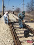 Frank and Steve sweeping and greasing the spring switch at the west end of Johnson Siding