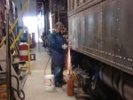 Welder Terry Borden does grinding on the last two patches needed to be welded onto 749.