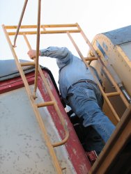 Mike Baksic working on the temporary diaphragm between Exhibit Cars 