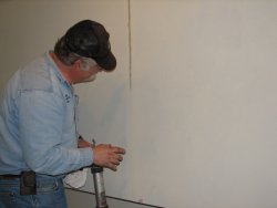 Mike Baksic caulking seams in the 2nd Exhibit Car November 3, 2013