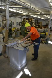 Mark cutting wood for the barrier in the 1st Exhibit Car