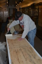 Kevin priming the vestibule closet door