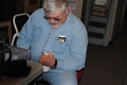 Mike Baksic modifying a light fixture for the 2nd Exhibit Car